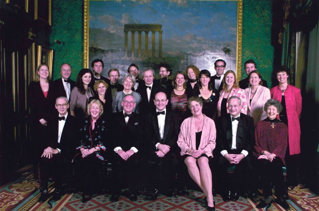 The Sainsbury Family and Michael Pattison (retiring SFCT director) sitting for a photograph at his retirement dinner.