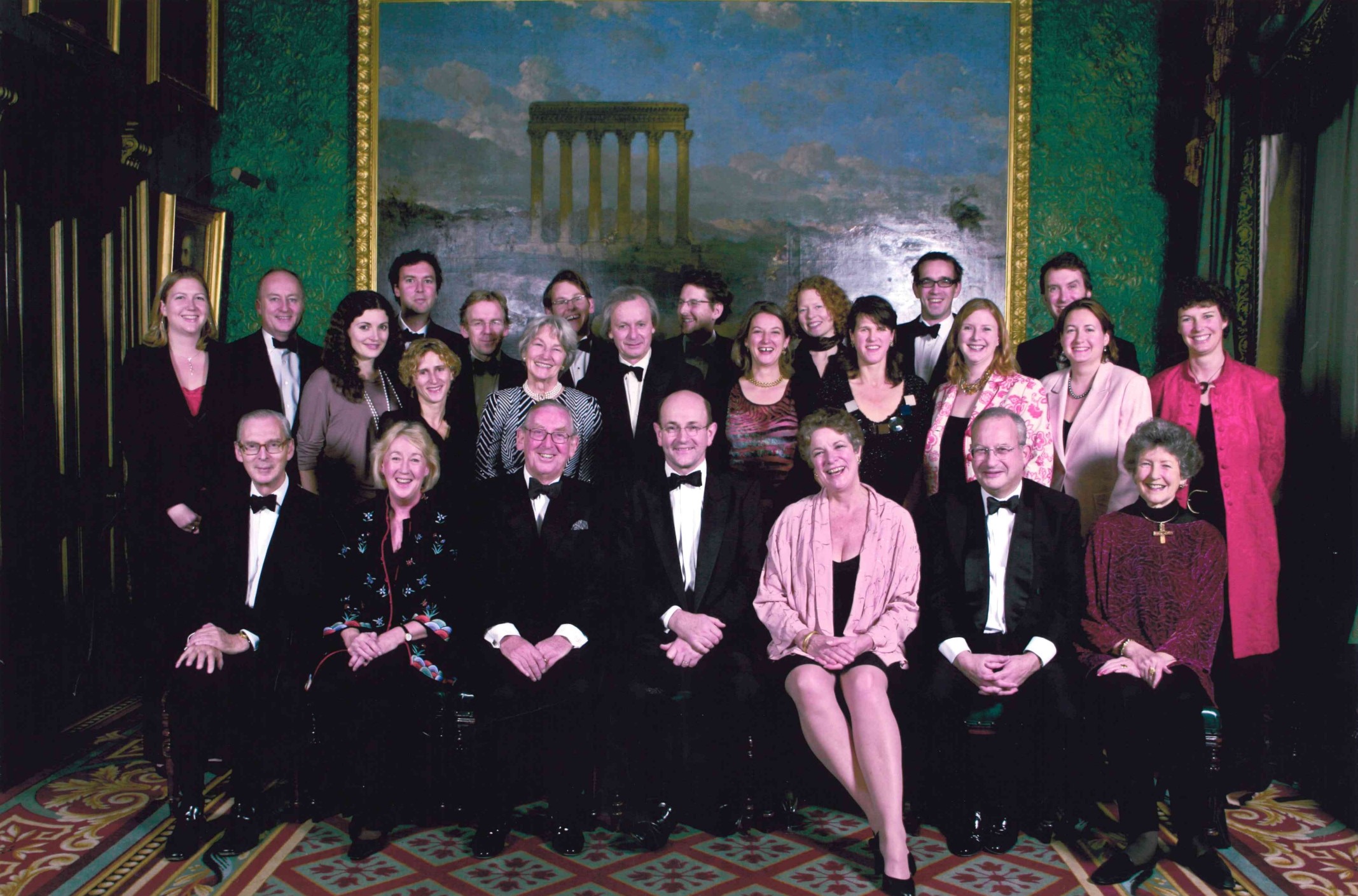The Sainsbury Family and Michael Pattison (retiring SFCT director) sitting for a photograph at his retirement dinner.